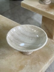 The container made of marble is like a plate