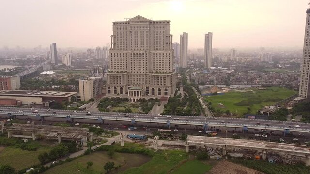 West Bengal, India-Beatiful aerial backward movement of ITC Sonar Bangla Hotel along with JSW Marriot hotel by it's side with blue sky in the background.Famous 5 star hotels of Kolkata.