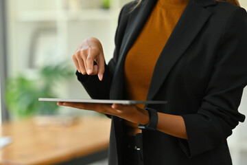 Closed up with Businesswoman in formal suit using digital tablet