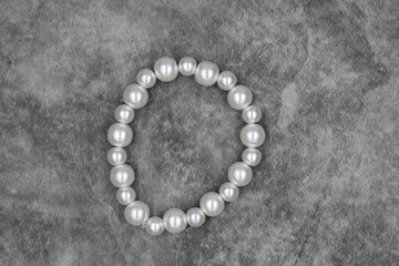 Bracelet made of natural stones on a dark background. Top view