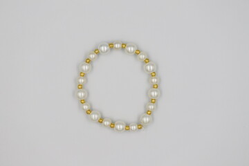 Bracelet made of natural stones on a white background. Top view