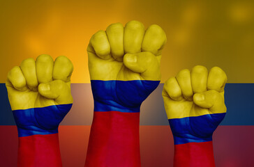 The Colombian flag is drawn on a clenched fist and in the background.