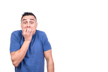Man biting his nails with panicked expression
