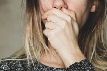the girl covered her mouth with her hand, stop stop and shut up