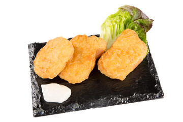 slate plate breaded chicken fried nuggets wings with bbq dipping sauce