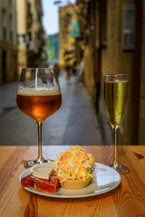 Spanish pintxos Russian salad with shrimp in a Basque bar, San Sebastian, Spain