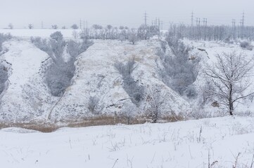 Winter landscape with ravine covered with fresh snow in ravines, of Dnipro city, Ukraine
