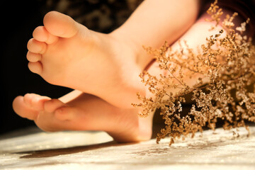 Close up bare foot in the morning at home, relaxing.  Lying and enjoying rest. Blurred with Shallow...