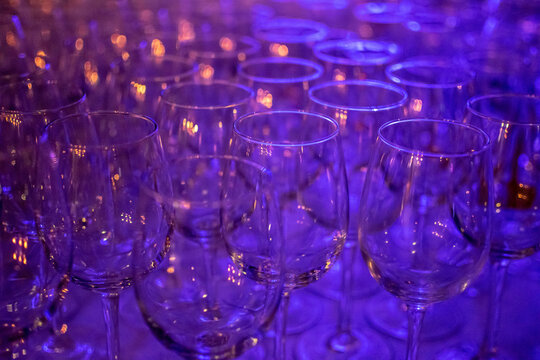 a collection of wine glasses on a bar counter ready to use abstract image 
