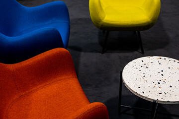 An empty meeting place during a pandemic. Colorful office chairs at the meeting place. lack of...