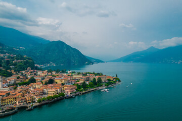 Fototapeta na wymiar Aerial view of Menaggio village on a coast of Como lake, Italy on a cloudy day