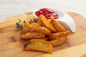 Fried rustic potato with tomato ketcup