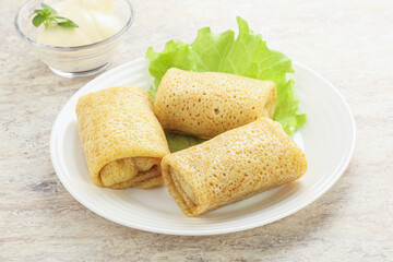 Stuffed pancakes with meat and cream