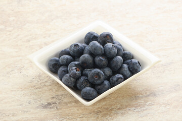 Sweet ripe blueberry heap in the bowl