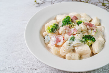 Korean food Spicy Stir-fried Carbonara tteokbokki dish on white plate
