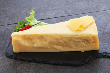 Parmesan cheese piece over board