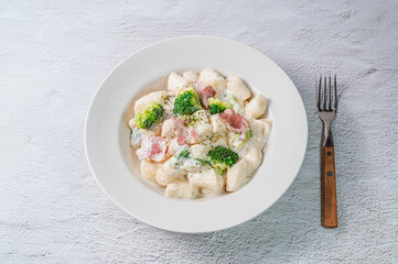 Korean food Spicy Stir-fried Carbonara tteokbokki dish on white plate