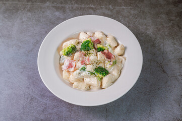 Korean food Spicy Stir-fried Carbonara tteokbokki dish on white plate