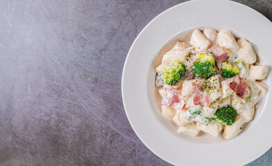 Korean food Spicy Stir-fried Carbonara tteokbokki dish on white plate