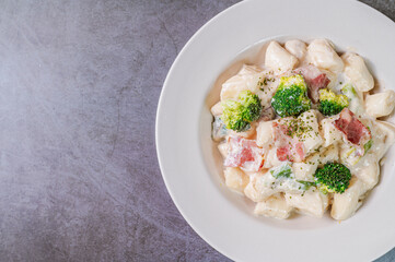 Korean food Spicy Stir-fried Carbonara tteokbokki dish on white plate