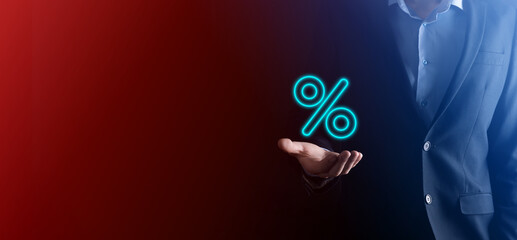 Male hand holding interest rate percent icon.Interest rate financial and mortgage rates...