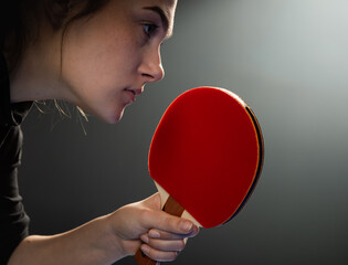 Young girl plays table tennis