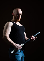 Brutal angry gang man lifestyle, serious handsome guy. Brutal man with baseball bat for fighting,...