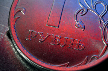 a Russian one ruble coin lies on a metal surface. close-up