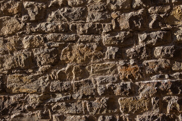 Old natural stone wall for background