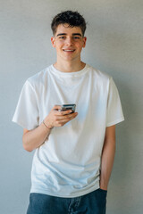 Fototapeta premium young teenager boy with mobile phone