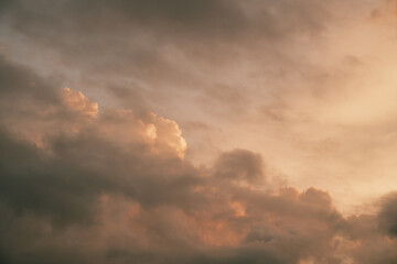 Heaven sky during sunset. Summer sky full of orange sunlight