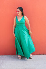 woman in green dress and sunglasses on the street