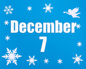 December 7th. Winter blue background with snowflakes, angel and a calendar date. Day 7 of month.