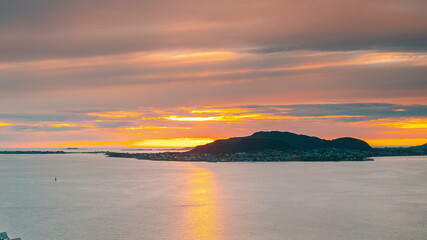 Alesund, Norway. Amazing Natural Bright Dramatic Sky In Warm Colours Above Alesund Valderoya And Islands In Sunset Time. Colorful Sky Background. Beauty In Norwegian Nature.