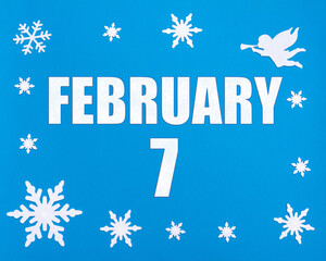 February 7th. Winter blue background with snowflakes, angel and a calendar date. Day 7 of month.