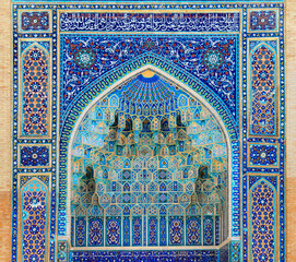 Arch portal with rich floral decoration in Ancient Mausoleum Gur Emir (Amir Timur tomb) in...