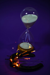 Hourglass with horseshoe and star thrower, symbolic