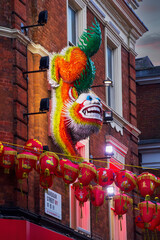 Lunar new year decorations on a building in Londons china town district.