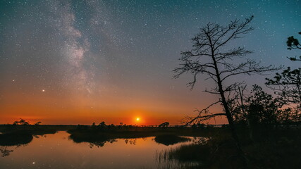 4K Miory District, Vitebsk Region, Belarus. Yelnya Swamp Nature Reserve Landscape. Night Starry Sky Milky Way Galaxy With Glowing Stars Moon. Famous Natural Landmark Nature Marsh