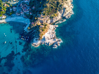 Aerial drone panorama view of the coast line, beach and crystal clear water of elba close to...