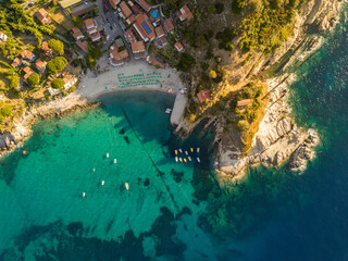 Fototapeta Aerial drone panorama view of the coast line, beach and crystal clear water of elba close to Sant'Andrea, Italy obraz