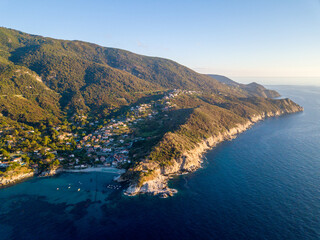 Aerial drone panorama view of the coast line, beach and crystal clear water of elba close to Sant'Andrea, Italy