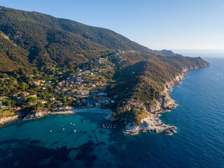 Aerial drone panorama view of the coast line, beach and crystal clear water of elba close to Sant'Andrea, Italy