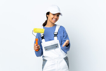 Painter woman over isolated white background shaking hands for closing a good deal