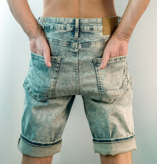 thin guy dressed new blue denim shorts