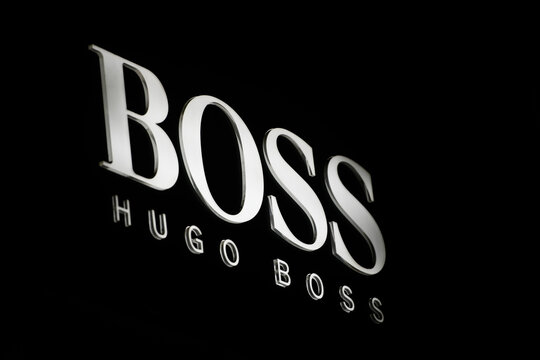 Hugo Boss logo displayed on a facade of a store in Milan.