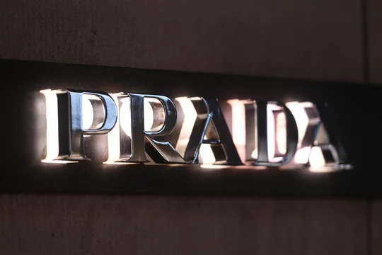 Prada logo displayed on a facade of a store in Milan. Stock Photo