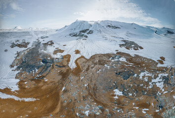 Aerial Drone view of Hverir in Winter with Snow. Icelandic Hverarond is geothermal area in Myvatn,...