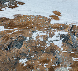 Aerial Drone view of Hverir in Winter with Snow. Icelandic Hverarond is geothermal area in Myvatn,...