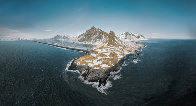 Drone view of a snow covered Eystrahorn mountain in Iceland at Hvalnes peninsula
